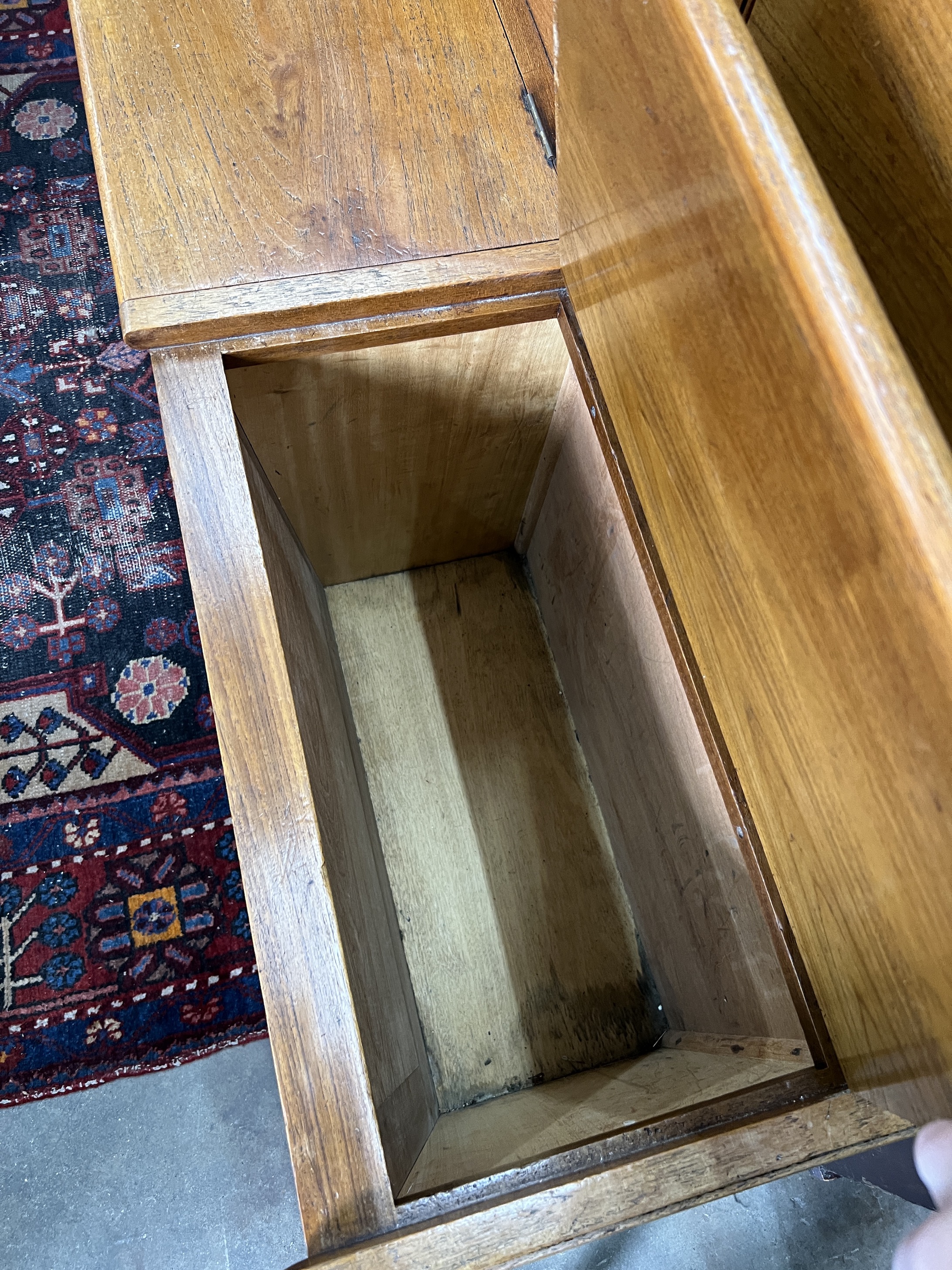 A mid century oak hall settle with triple hinged box seat, width 178cm, depth 40cm, height 106cm